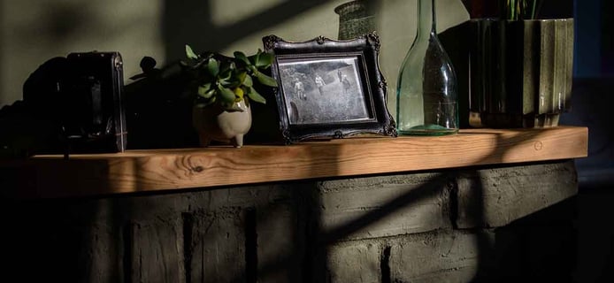 Picture of a light being lit of the charming fireplace in the 100-years old house. Creator: Slawek Dejneka