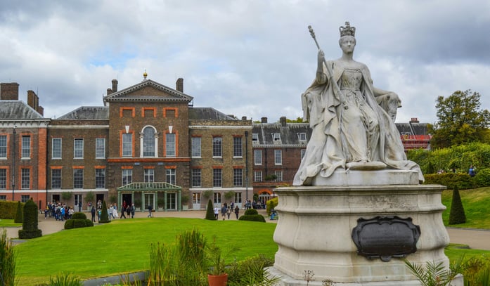 Kensington Palace exterior with a statue of a woman in a dress and a crown