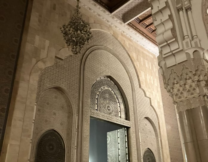 mosque entrance with artwork and pillars