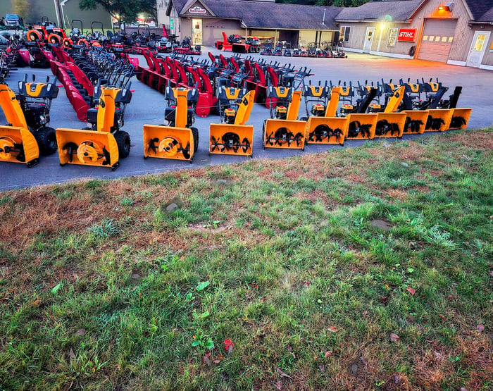 view of joes equipment as you approach it with a large assortment of snow blowers on display