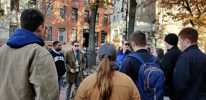 Dr. Hooton discussing LGBTQ+ history in New York City with students. Outside The Stonewall Inn in NY