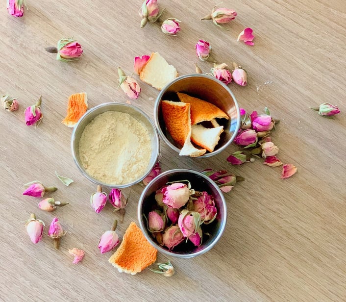 one bowl of dried orange peel one bowl of flour and a bowl of dried flowers