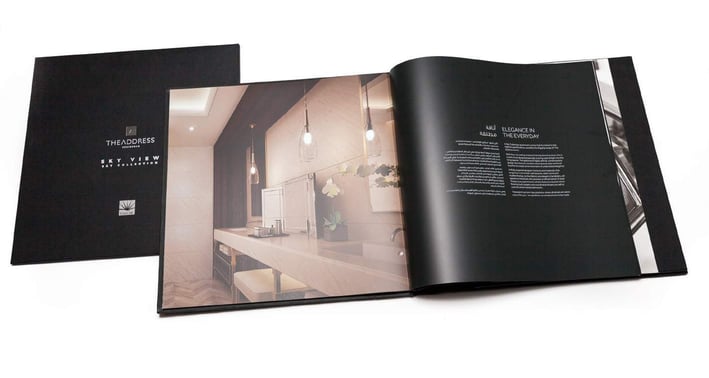 a book opened to show a book with a picture of a bathroom