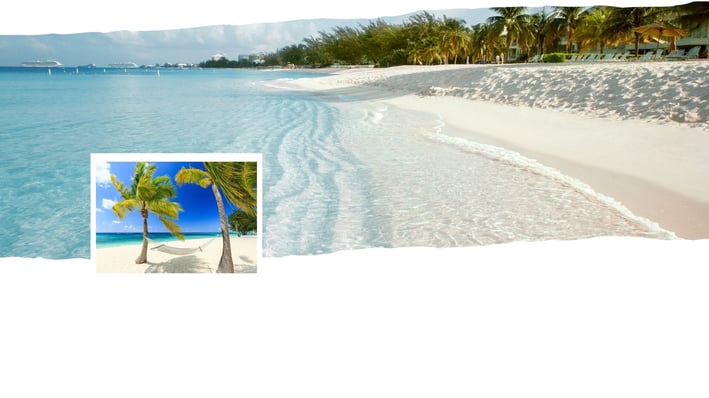 Vista panorâmica de Grand Cayman com mar cristalino, faixa de areia clara e vegetação tropicall.
