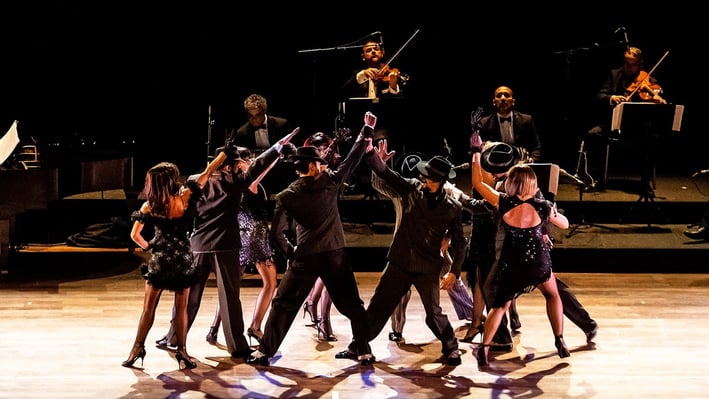 a group of dancers performing a dance routine