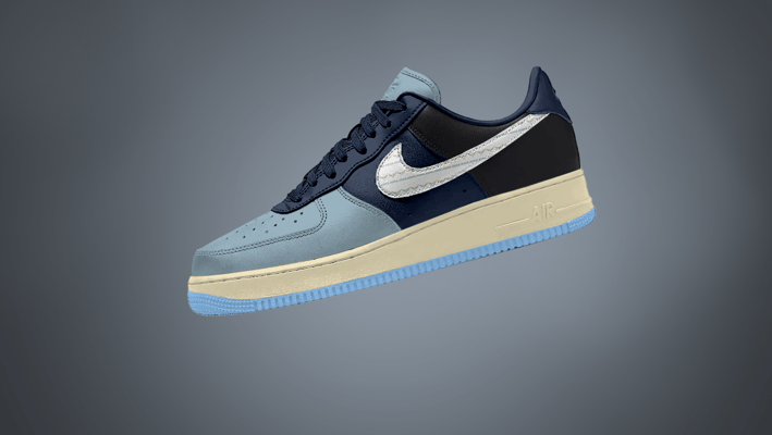Free Nike Sneaker mockup showcasing left side view in navy, powder blue, and black color-block desig