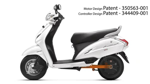 a white scooter with a black seat and a white scooter