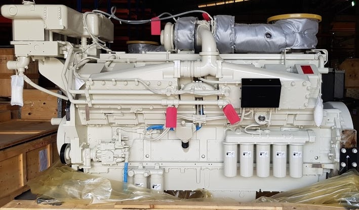 a large white engine on a wooden table