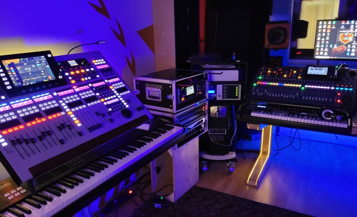 three audio mixers in a music studio with a keyboard and a keyboard