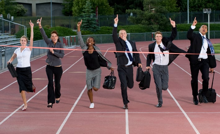 a group of business people running on a track