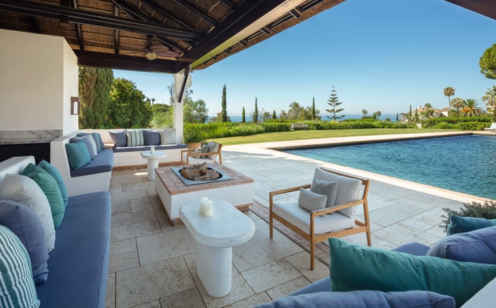 Garden, pool, and Mediterranean views from the pool house at Villa La Gratitud.