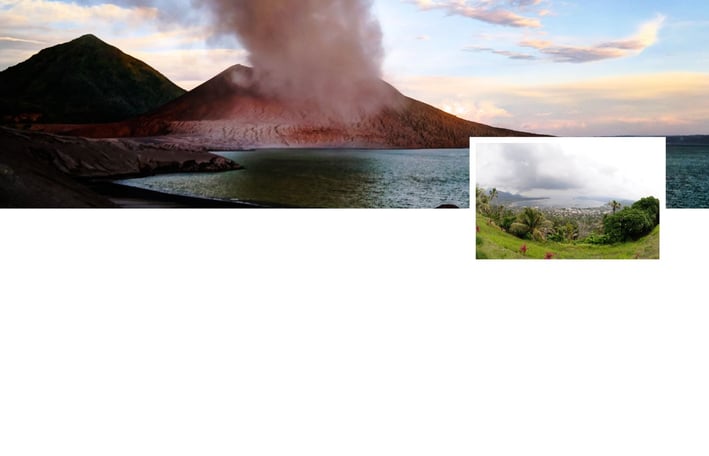 Paisagem vulcânica de Rabaul, Papua-Nova Guiné, com o vulcão Tavurvur ao fundo soltando fumaça.