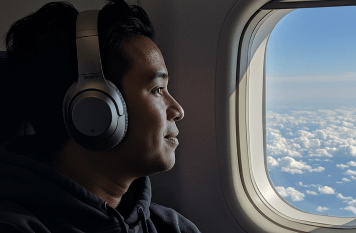 Noise cancelling headphones on a long airplane flight
