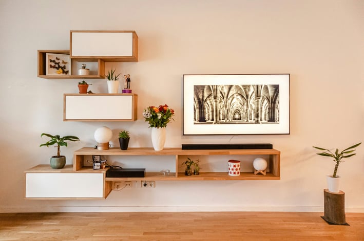 a living room with a television and a picture frame