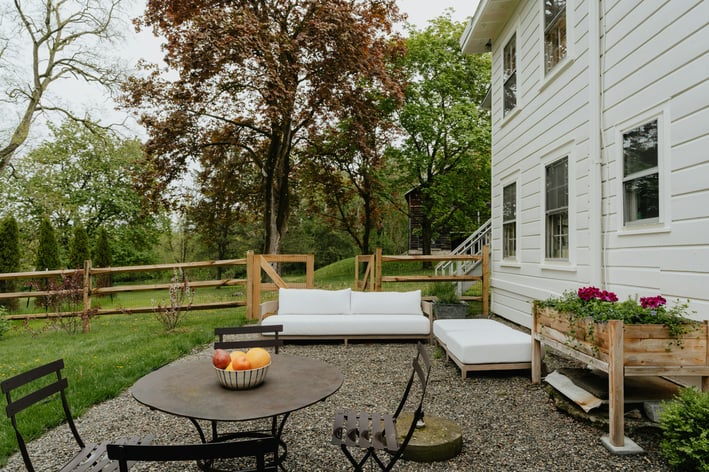 a patio with a couch and a table