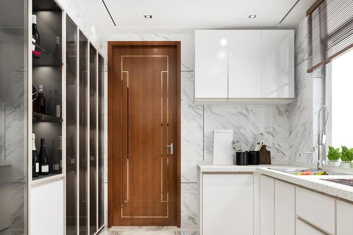 a kitchen with a wooden door and a wooden door