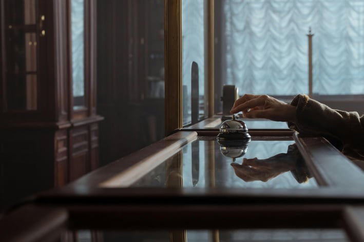 a person sitting at a table with a cup of coffee