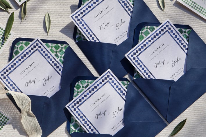 opened wedding invitations with custom envelope liner and leaves all around