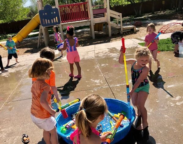 a group of children playing in preschool in Reno