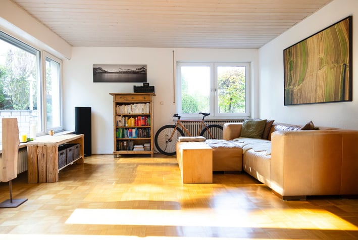 a living room with a couch and a bike