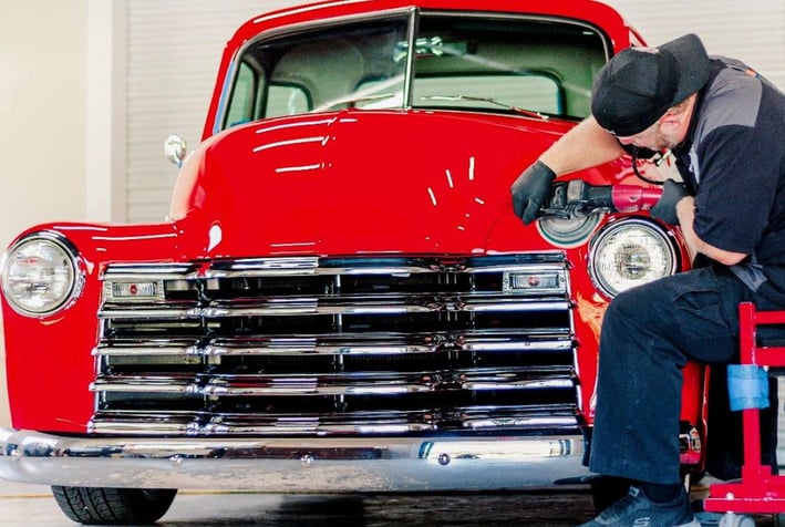 owner of  D and P Auto Detailing working on a car