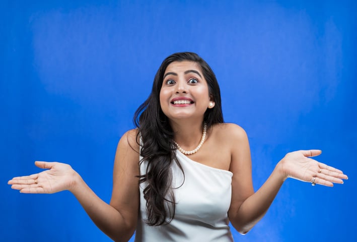 a Lanka Ads woman in a white dress and pearls necklaces