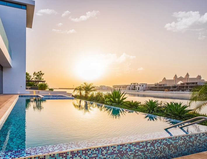 Luxury villa at Palm Jumeirah during sunset, showcasing Altessa's property management services