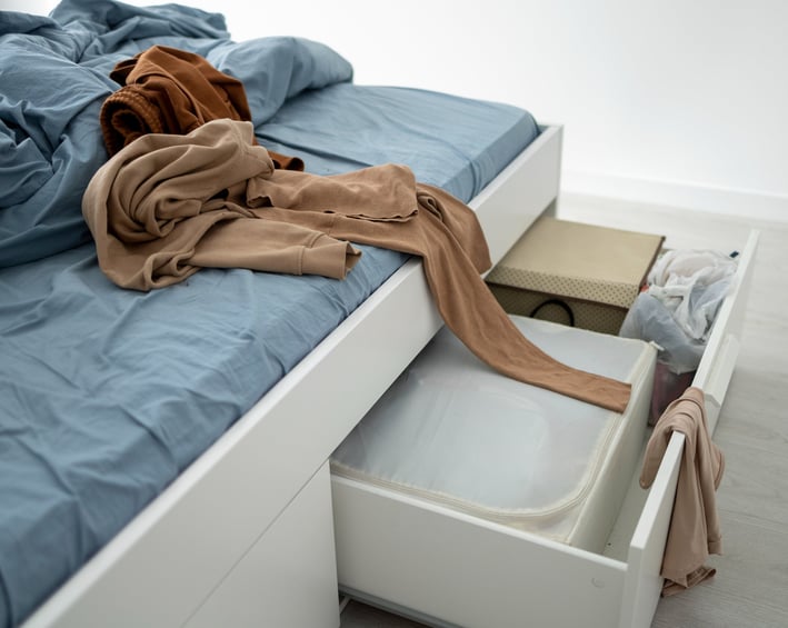 a bed with a blanket and a blanket on top of it