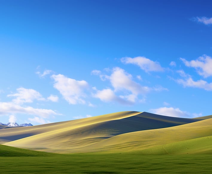 wallpaper - a green field with a blue sky and clouds