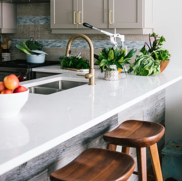 a kitchen with a bowl of fruit and vegetables