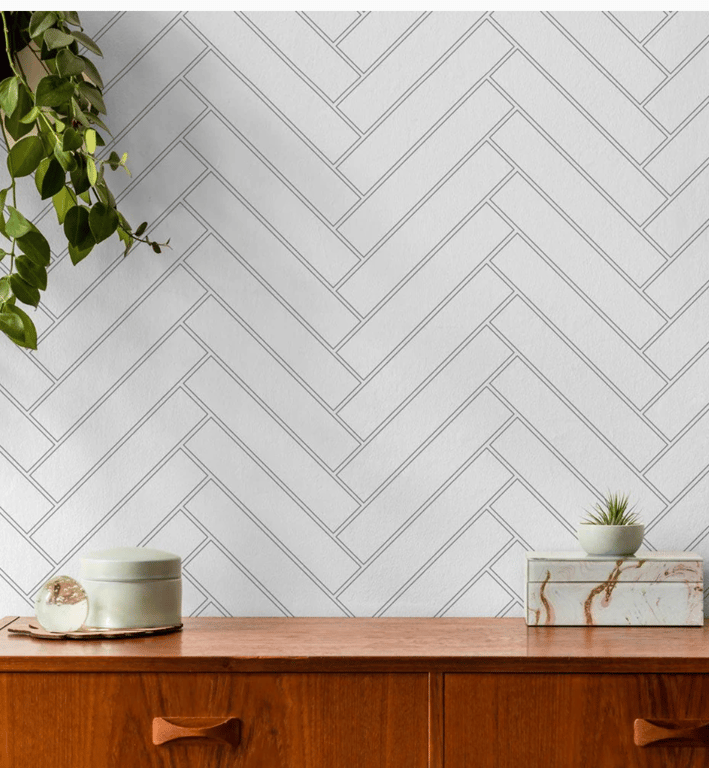 White herringbone peel and stick tile with brown wooden furniture