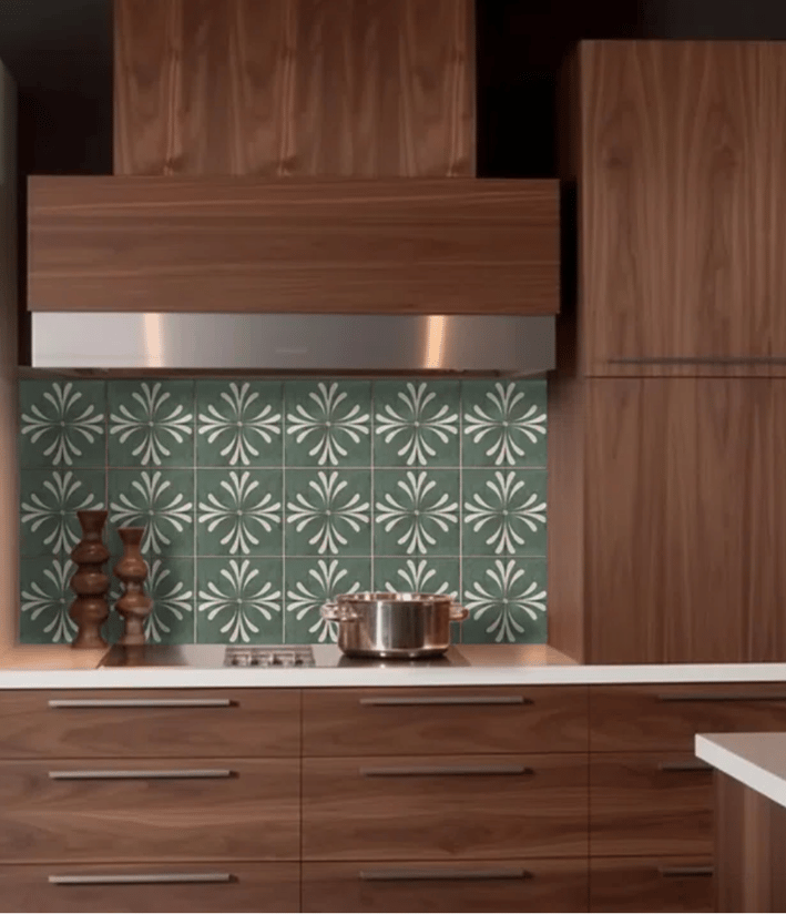 brown kitchen cabinets with green color patterned peel and stick back splash