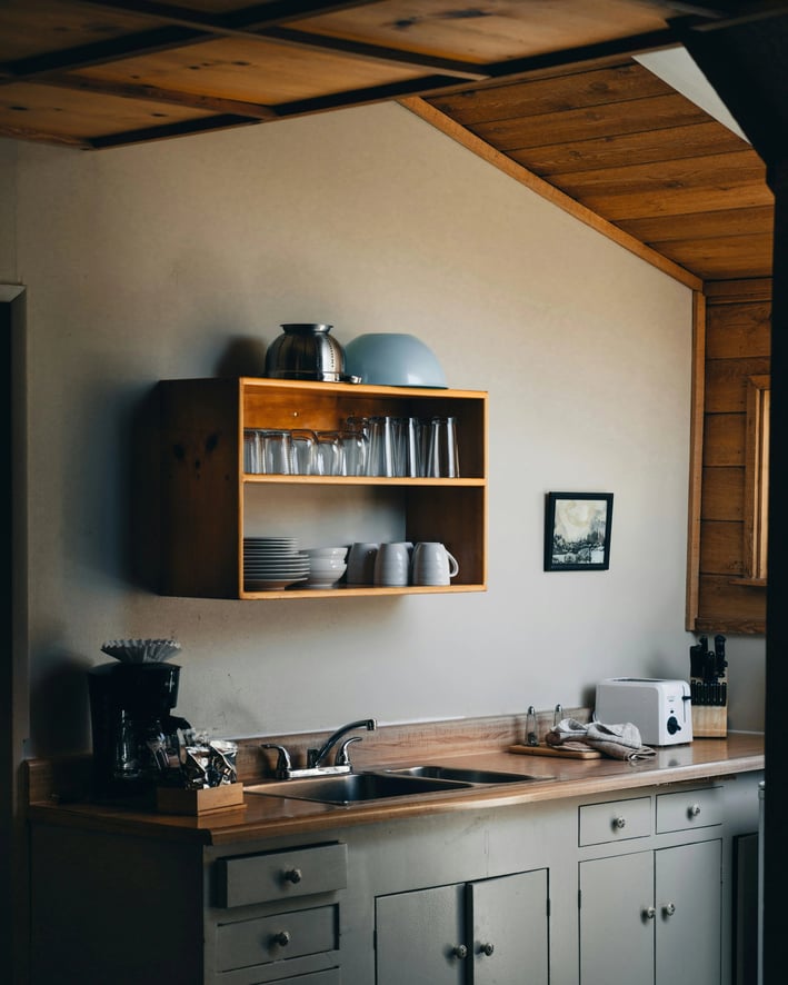 a kitchen with a wooden counter top and a wooden counter top