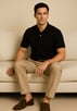 a man sitting on a couch with his feet up