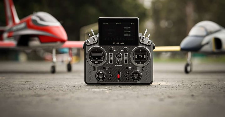 FrSky X20 Pro Transmitter being flanked by 1 red RC Jet and 1 grey RC Jet