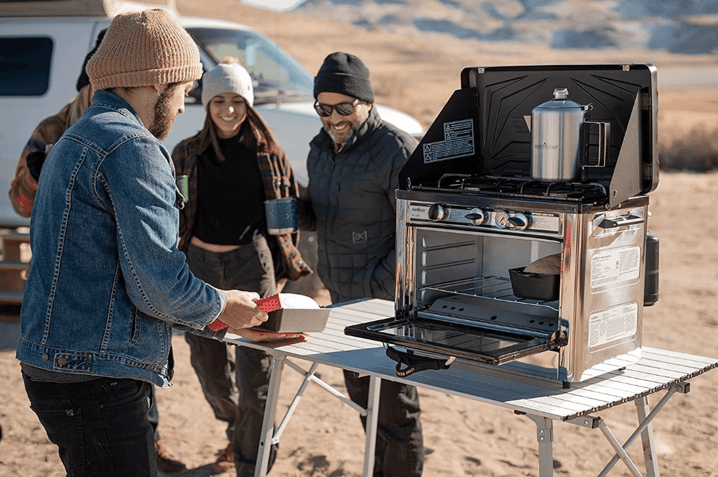 campers using a Camp Chef Portable Camp Oven for easy camp cooking