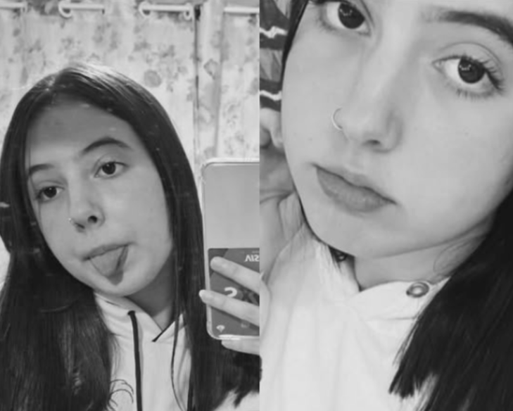 a woman with long hair and a white shirt