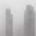 Urban themed graphic - silhouette of city buildings through the fog
