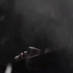 Dark cinematic shot - main in black hoodie face as he is free falling side view