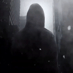Dramatic close up city shot - figure standing alone in hoodie