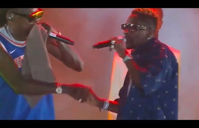 Vybz Kartel shaking Shatta Wale's hands on stage at his Freedom Concert.