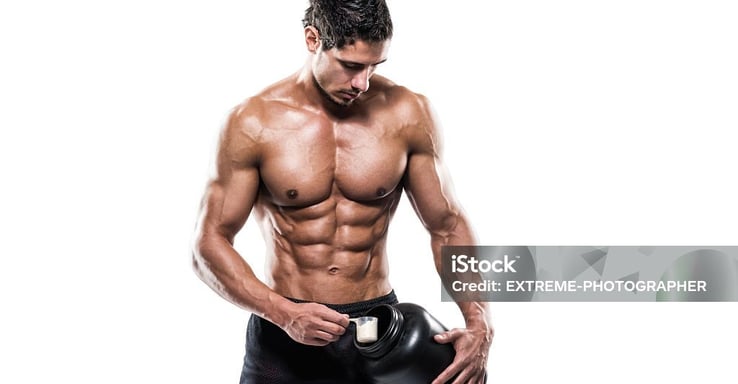 a man with a protein container