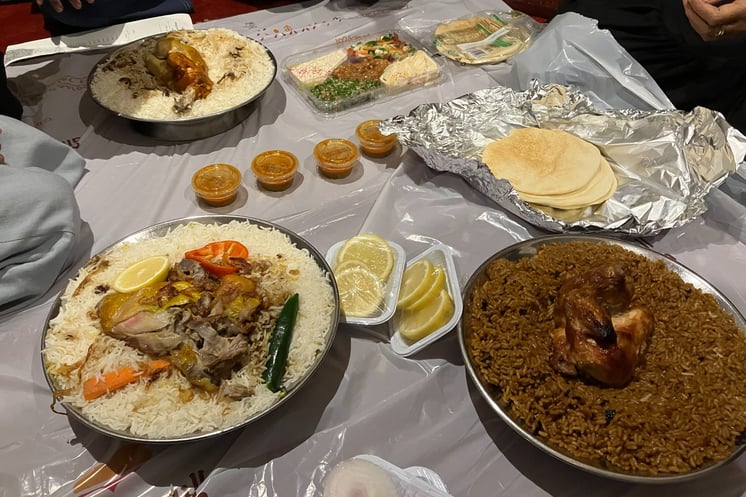 a table with a variety of Arab food in Jeddah, Saudi Arabia