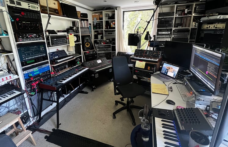 audio production suite with keyboard and synthesizers