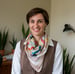 A photo of a woman wearing a polyester scarf in an office setting