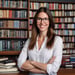 a woman in glasses and a white shirt