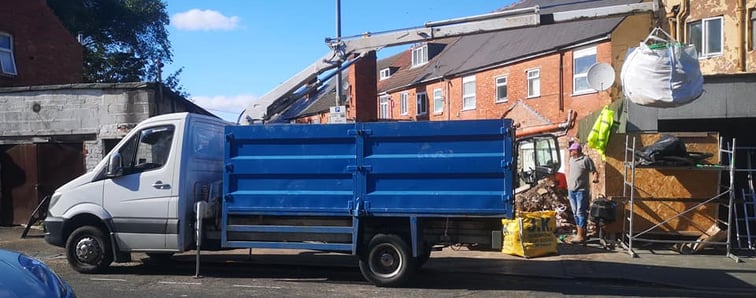 blue pick up truck with extended grabber in birmingham