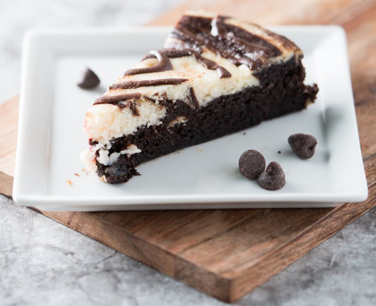 a slice of cake with chocolate chips and chocolate chips