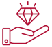 a hand holding a diamond shaped diamond in a hand