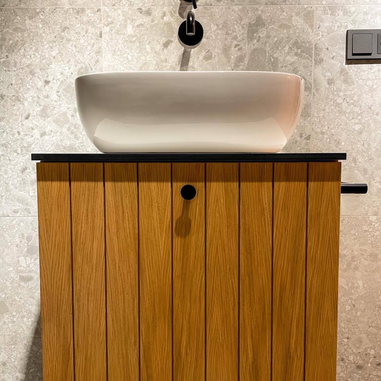 Custom bathroom furniture in natural oak bringing warmth, balance, and harmony to the space